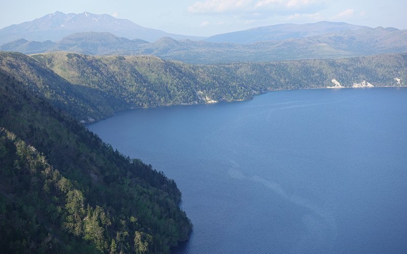 Lake Mashu with Mount Shari in the background